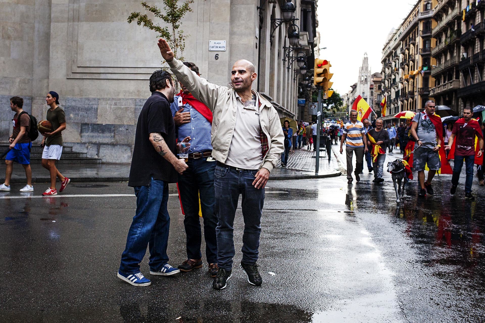 A man doing a fascist greeting in an act in favor of the union of Spain and against the referendum of Catalan self-determination, made the day before the referendum declared illegal by the Spanish Government.